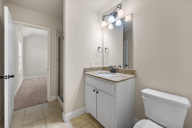 bathroom featuring toilet, vanity, baseboards, and a shower stall
