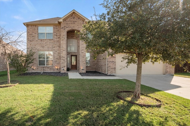 traditional home with a front lawn, driveway, an attached garage, and brick siding