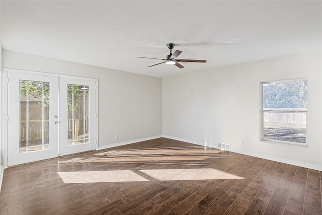 spare room with french doors, dark hardwood / wood-style floors, and ceiling fan