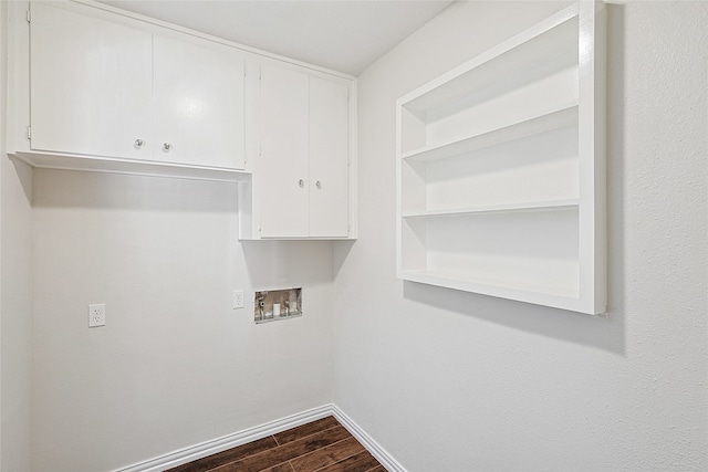 clothes washing area with washer hookup, cabinets, and dark wood-type flooring