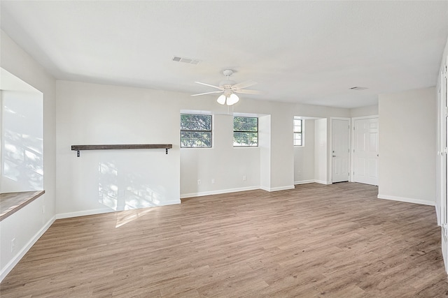 unfurnished living room with ceiling fan and light wood-type flooring