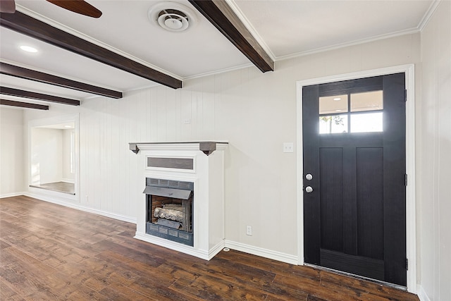 entryway featuring beamed ceiling, ornamental molding, and dark wood-type flooring