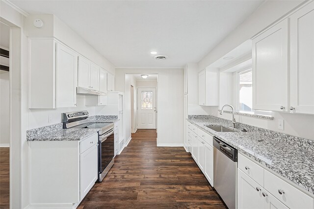 kitchen with white cabinetry, sink, stainless steel appliances, and dark hardwood / wood-style floors