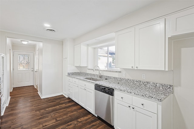 kitchen featuring dishwasher, dark hardwood / wood-style flooring, white cabinetry, and sink