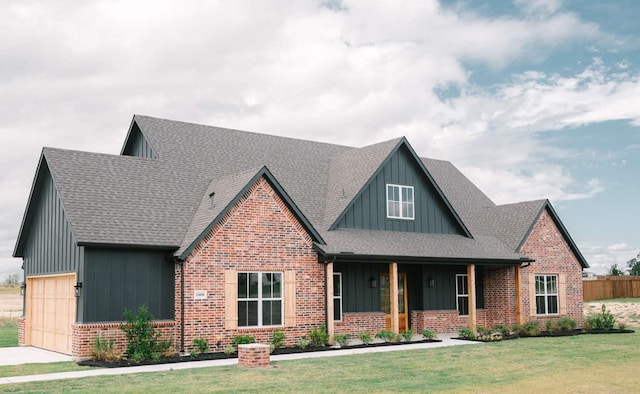 view of front of home with a garage and a front yard