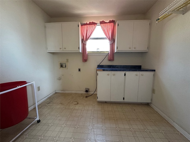 clothes washing area with electric dryer hookup, cabinets, and hookup for a washing machine