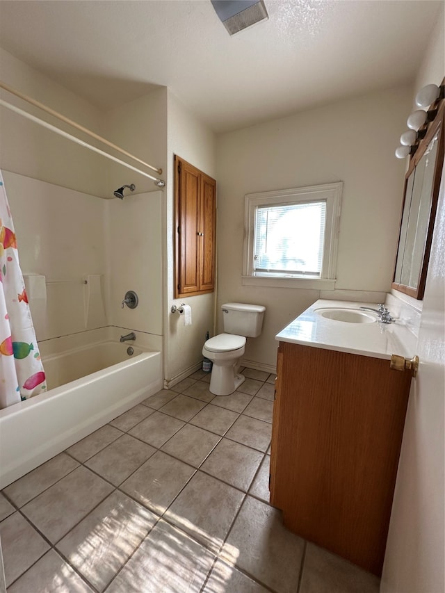 full bathroom with tile patterned flooring, vanity, shower / tub combo with curtain, and toilet