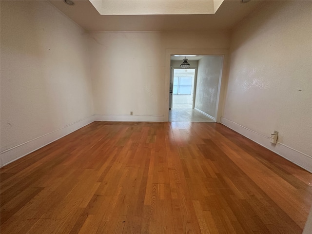 unfurnished room featuring hardwood / wood-style floors