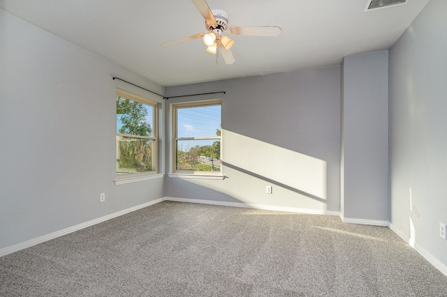 empty room featuring carpet and ceiling fan