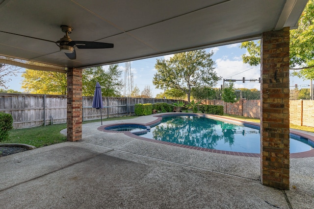 view of swimming pool featuring ceiling fan and a patio area