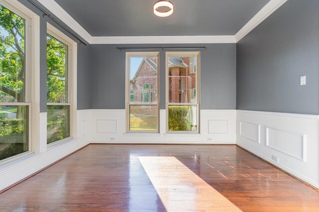 unfurnished room featuring dark hardwood / wood-style flooring and ornamental molding