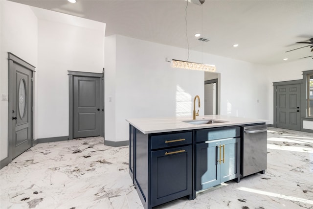 kitchen featuring a center island with sink, sink, hanging light fixtures, blue cabinetry, and plenty of natural light