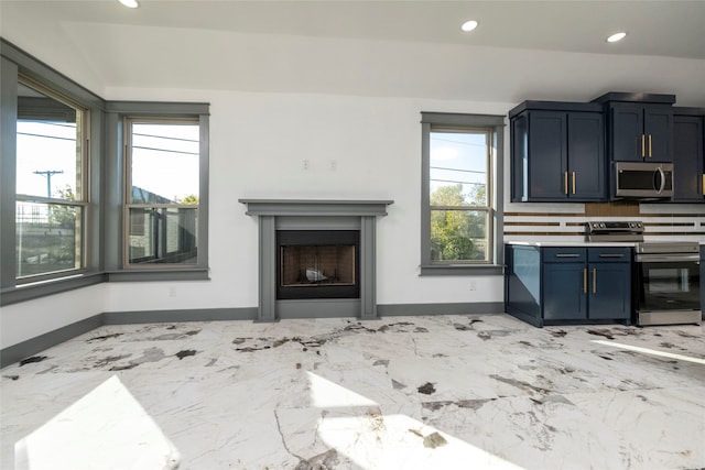 unfurnished living room with a wealth of natural light