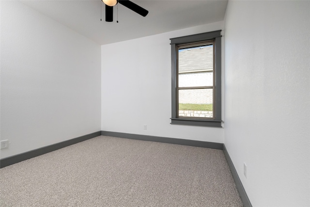 empty room with carpet and ceiling fan