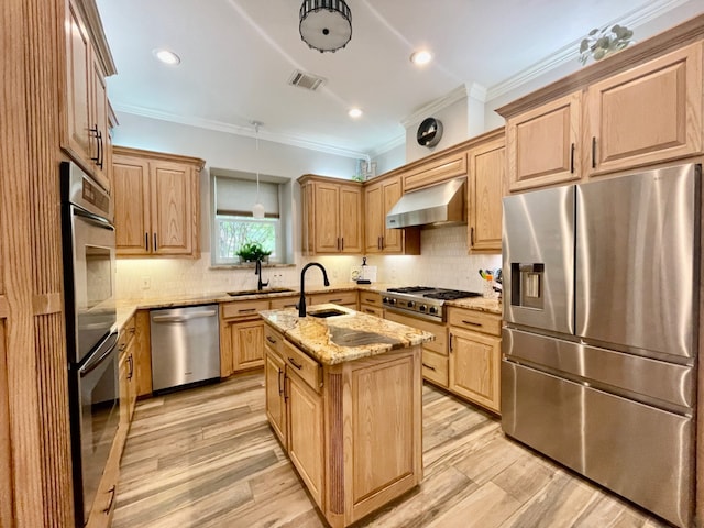 kitchen featuring a center island with sink, sink, wall chimney exhaust hood, light stone countertops, and stainless steel appliances