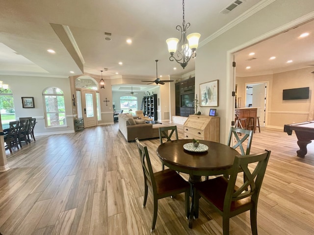 dining space featuring ceiling fan with notable chandelier, light wood-type flooring, ornamental molding, and billiards