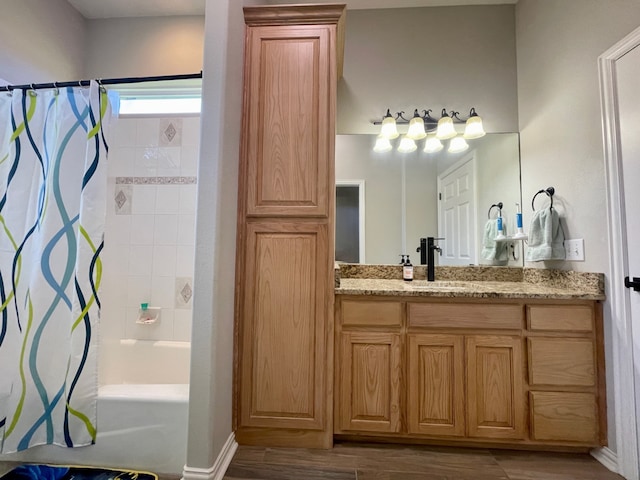 bathroom featuring hardwood / wood-style floors, vanity, and shower / bath combination with curtain