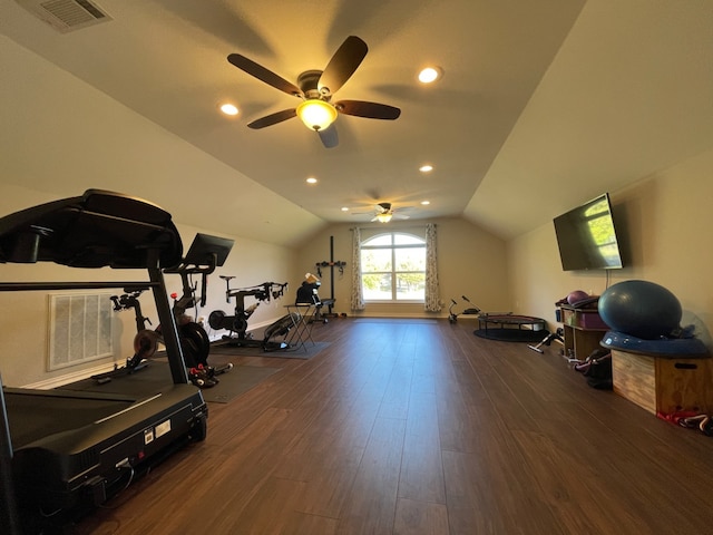 exercise area with ceiling fan, dark hardwood / wood-style floors, and vaulted ceiling