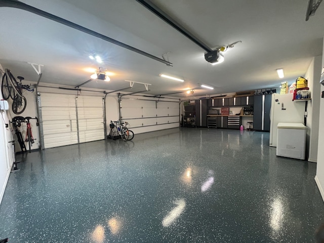 garage featuring a garage door opener