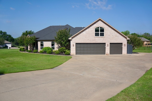 view of front of house featuring a garage and a front yard