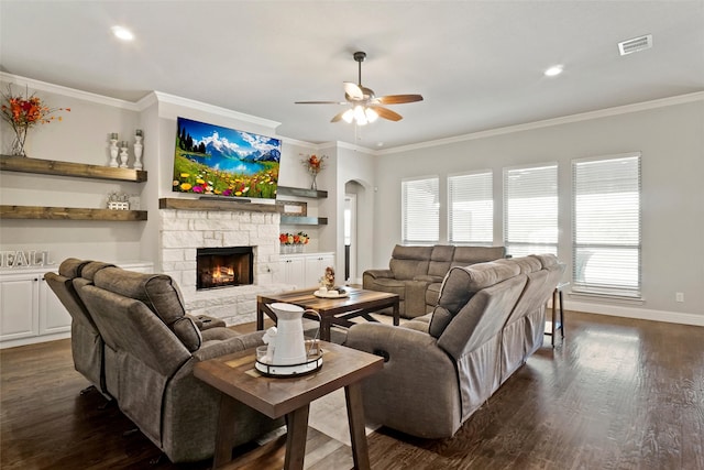 living room with a fireplace, dark hardwood / wood-style flooring, and crown molding