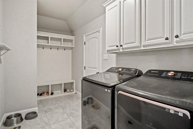 washroom with cabinets and separate washer and dryer