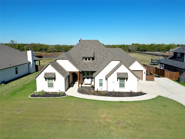 modern farmhouse style home with a front lawn