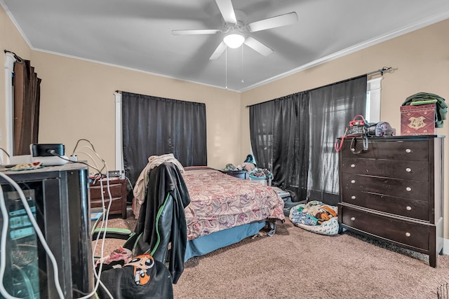 bedroom with carpet flooring, ceiling fan, and ornamental molding