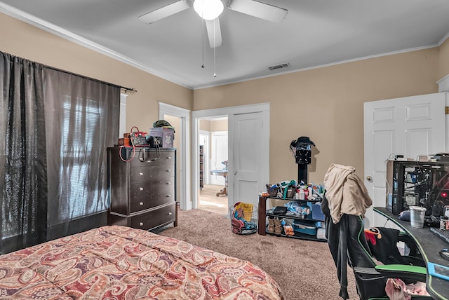 carpeted bedroom featuring ceiling fan and ornamental molding