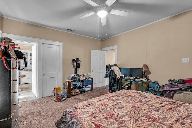 bedroom featuring carpet, ceiling fan, and ornamental molding