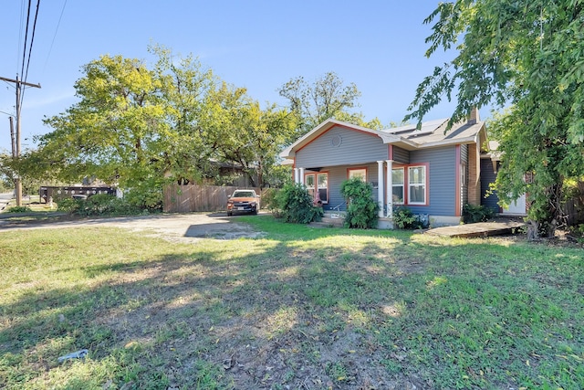 exterior space with a porch and a front yard