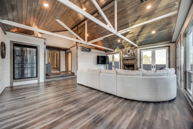 unfurnished living room featuring french doors, wood ceiling, a fireplace, vaulted ceiling with beams, and dark hardwood / wood-style floors