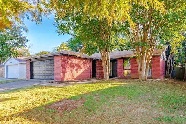 ranch-style home with a front yard and a garage