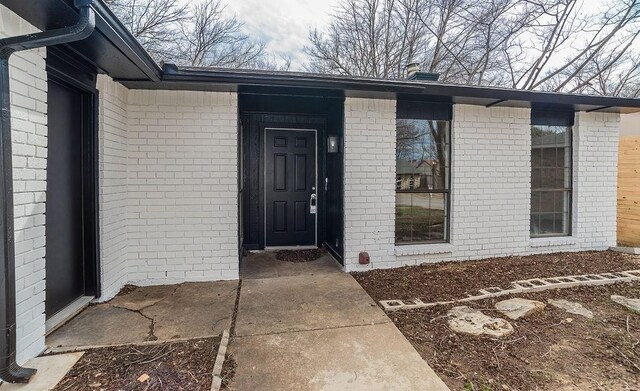 view of front of house featuring central AC unit and a garage