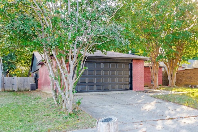 view of front of house featuring central AC unit and a garage