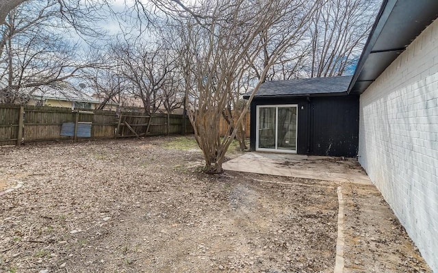 view of yard with a fenced backyard and a patio