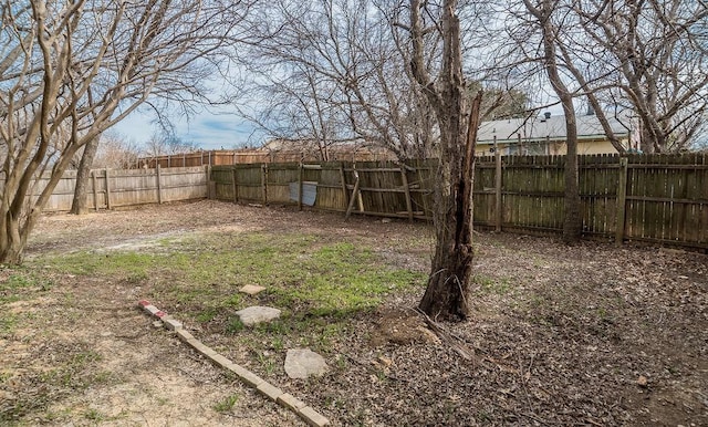 view of yard with a fenced backyard