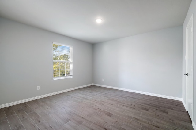 spare room featuring hardwood / wood-style floors