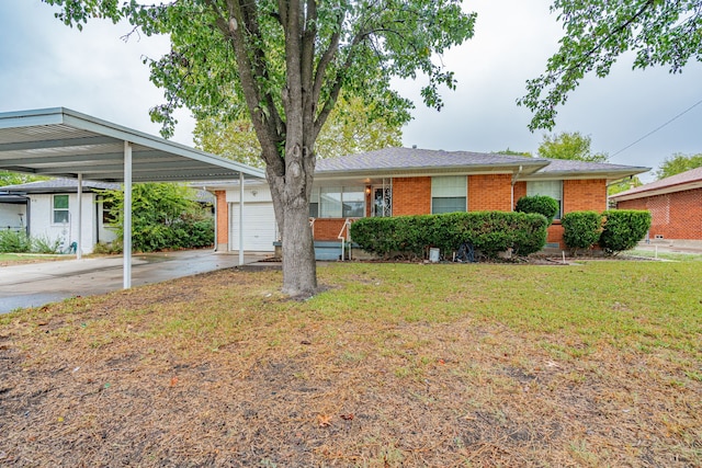 ranch-style home featuring a front lawn, a garage, and a carport