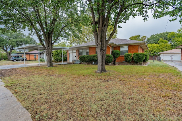 view of front of house with a front lawn and a carport