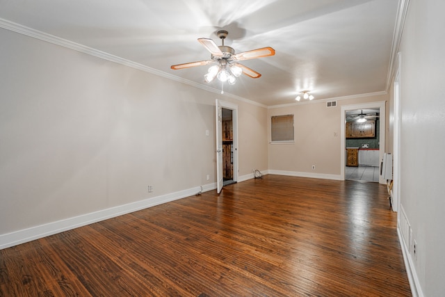 spare room with dark hardwood / wood-style flooring, ceiling fan, and ornamental molding