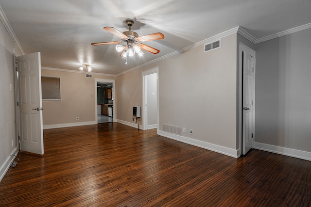 spare room featuring heating unit, crown molding, ceiling fan, and dark hardwood / wood-style floors