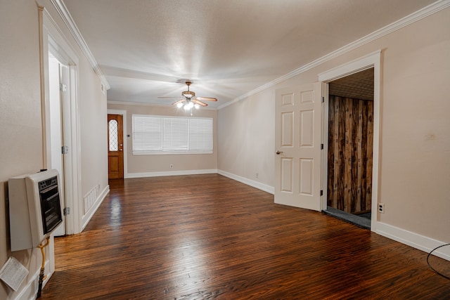 unfurnished living room featuring heating unit, crown molding, dark hardwood / wood-style flooring, and ceiling fan