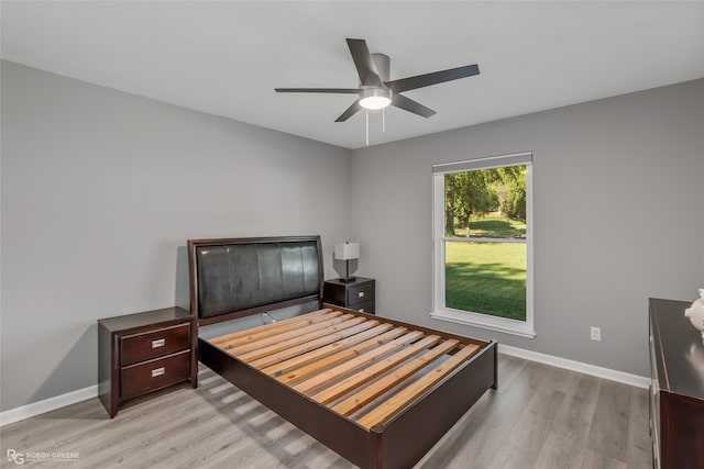 bedroom featuring light hardwood / wood-style flooring and ceiling fan