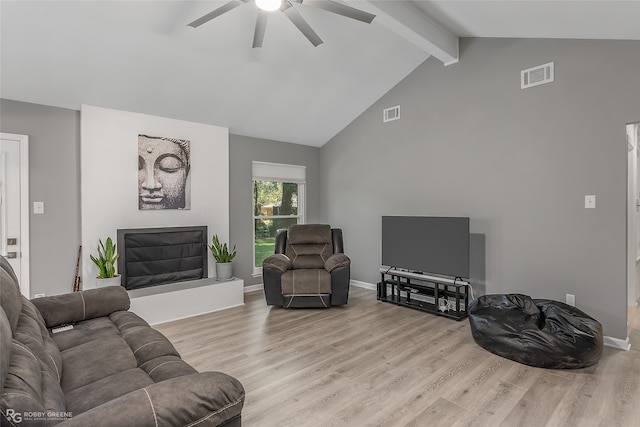 living room featuring vaulted ceiling with beams, ceiling fan, and light hardwood / wood-style floors