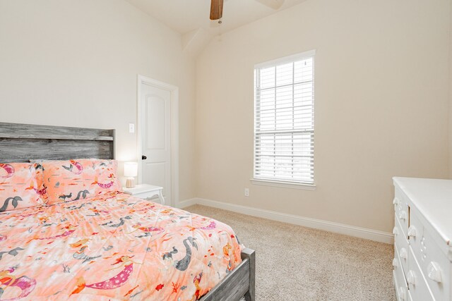 bedroom with ceiling fan, light colored carpet, and multiple windows