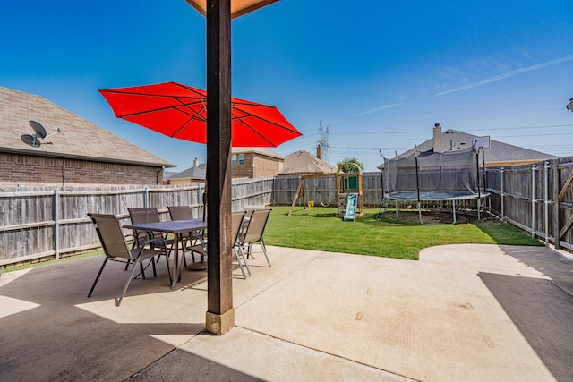 view of patio / terrace featuring a playground and a trampoline