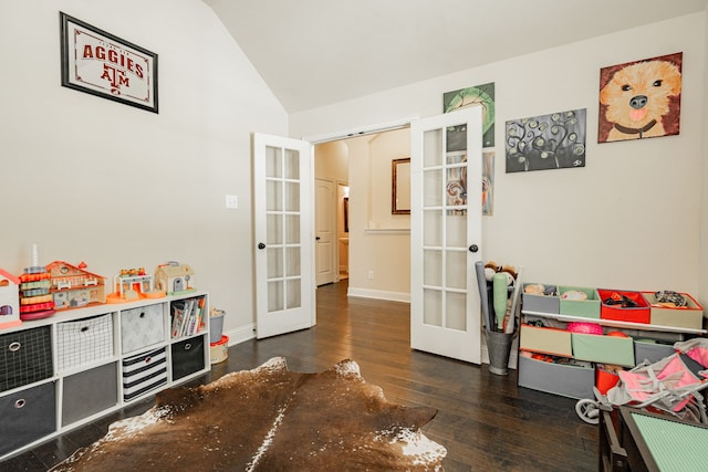 rec room featuring dark hardwood / wood-style flooring, lofted ceiling, and french doors