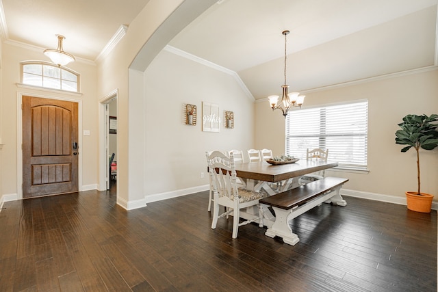 dining space with a chandelier, dark hardwood / wood-style flooring, vaulted ceiling, and ornamental molding