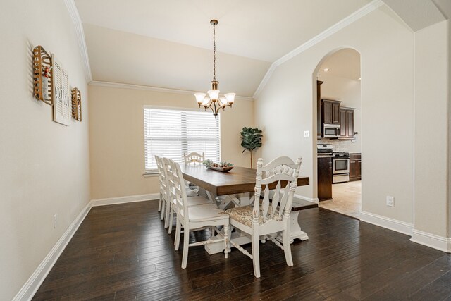 dining space featuring crown molding, dark hardwood / wood-style flooring, lofted ceiling, and an inviting chandelier